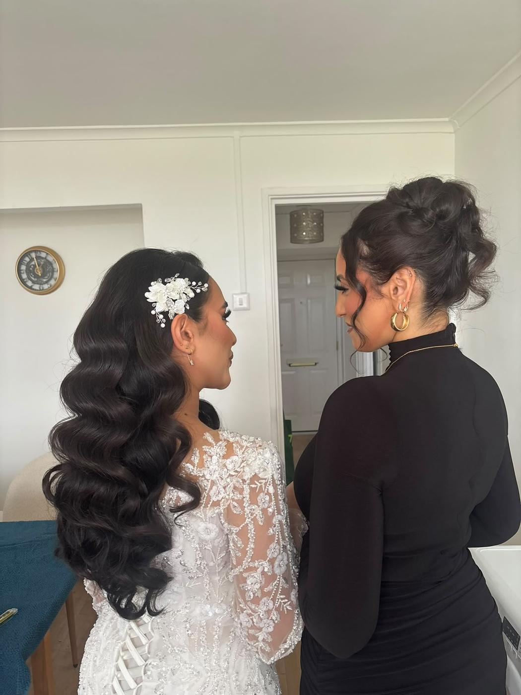 Long Hollywood waves finished with a pearl hairpiece