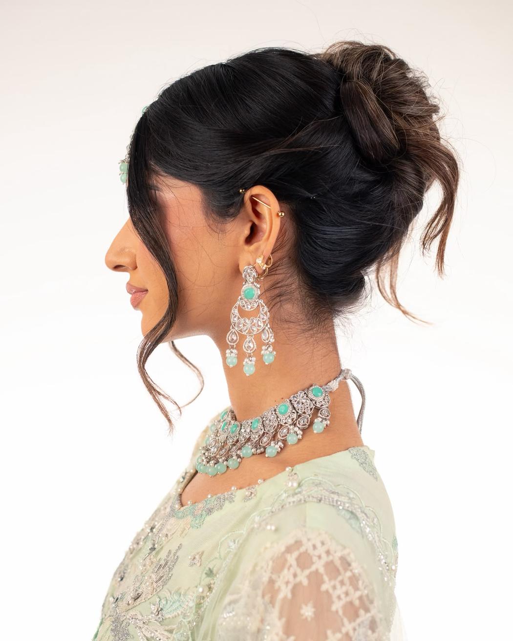 Sculpted textured bun with soft face-framing pieces